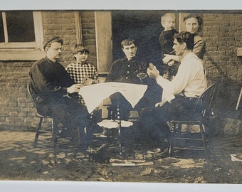 Five Guys RPPC Men in Hats Three Laying in Grass Hands to Cheeks Photo Postcard