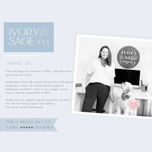 May include: Black and white photo of a woman standing next to a dog. The woman is wearing a white shirt and black pants. The dog is a small, fluffy breed. The woman is smiling and the dog is looking at the camera. The woman is standing in front of a desk with a computer monitor and a sign that says "ivory & sage company". The text "meryl, our shop pup!" is written on a pink heart sticker on the dog's collar.