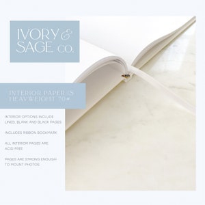 May include: An open notebook with white pages and a ribbon bookmark. The text on the image reads "IVORY & SAGE CO." and "INTERIOR PAPER IS HEAVYWEIGHT 70#." Additional text states the notebook includes lined, blank, and black pages, and is acid-free.