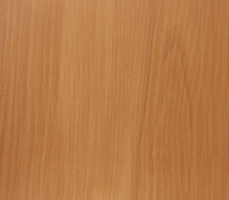 May include: Close-up of a light brown wood grain pattern. The wood grain has vertical lines and a natural, warm color. The wood appears to be smooth and polished, with a subtle sheen. This image is suitable for backgrounds or textures.