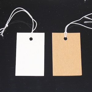 Mark your products with these economical tags. Tags are pre-strung and easy  to attach to you merchandise. - 5½ long string.-Often used with a