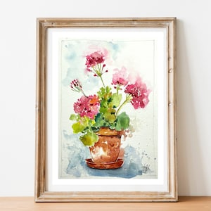 Peut inclure: Peinture à l'aquarelle de géraniums roses dans un pot en terre cuite. Les fleurs sont en fleurs et les feuilles sont vertes. L'arrière-plan est une aquarelle bleu clair.