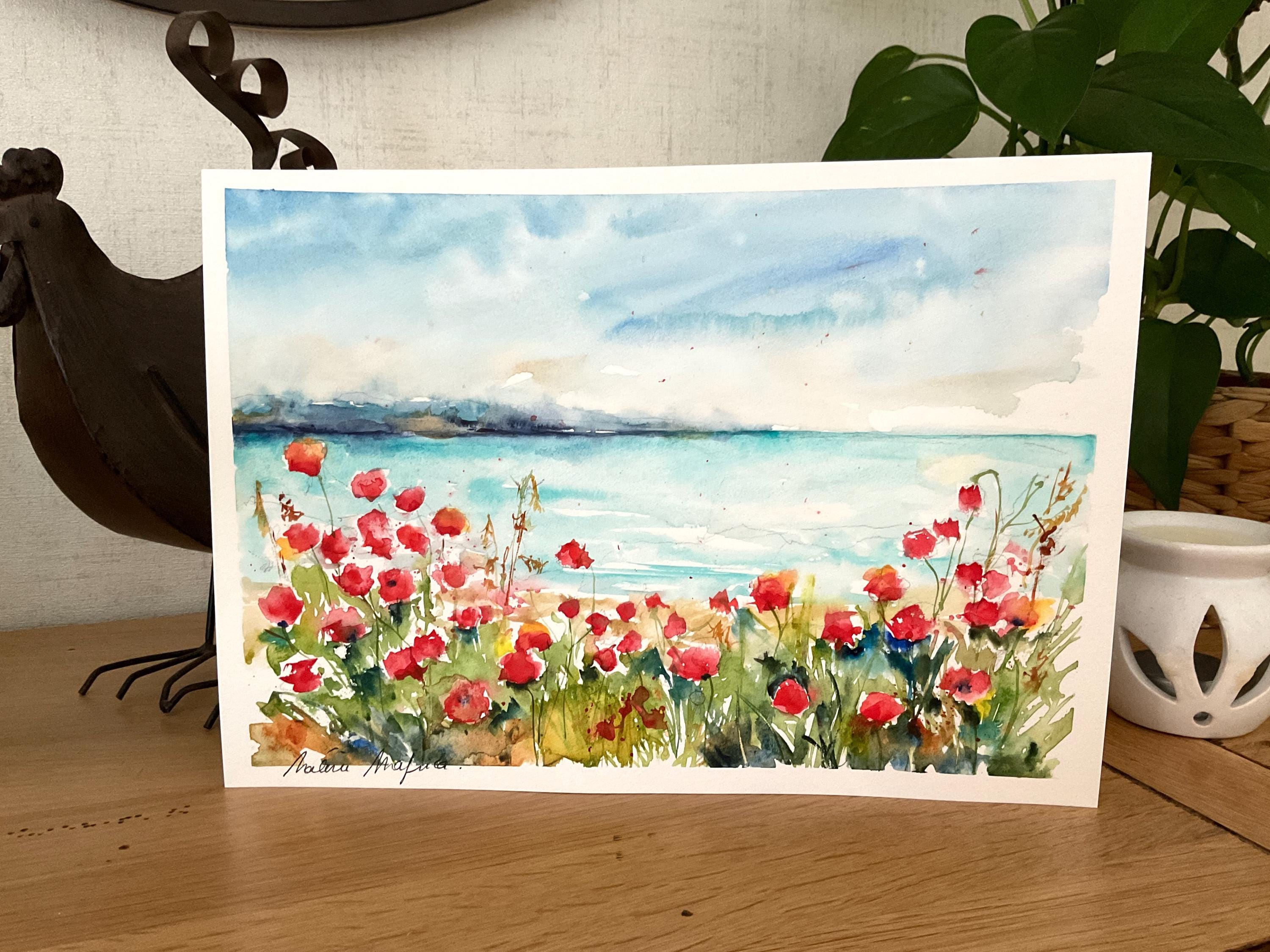 海辺に咲く赤いポピーを描いたオリジナルの水彩画。鮮やかな赤いポピー