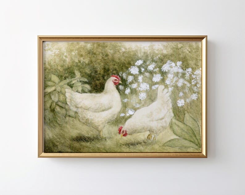 May include: A framed print featuring two white chickens in a garden setting. The chickens have red combs and are surrounded by green foliage and white flowers. The artwork is set in a gold-colored frame.