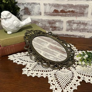 Antique Baroque Style Bronze Tone Oval Wall Hung Vanity Mirror w/ Scroll Design | Made in Italy | Wall Hung Decorative Brass Frame Mirror