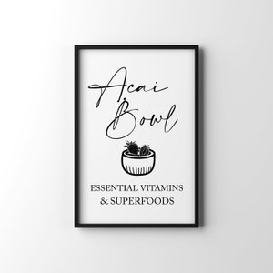 May include: Black and white printable art print with the text "Acai Bowl" in cursive script. A black and white illustration of a bowl with berries is below the text. The text "Essential Vitamins & Superfoods" is below the illustration.