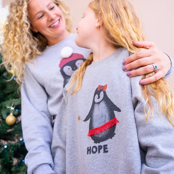 Mother and daughter top matching christmas jumpers