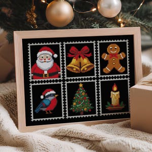 May include: A framed cross-stitch featuring Christmas-themed postage stamp designs. The stamps depict Santa Claus, bells, a gingerbread man, a bird, a Christmas tree, and a candle. The frame is light brown, and the background includes a Christmas tree and a wrapped gift.