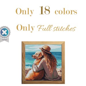 May include: A framed cross-stitch artwork depicts a person with long hair and a straw hat embracing a golden retriever on a beach. The artwork is in a wooden frame. Text above the artwork reads "Only 18 colors" and "Only Full stitches."