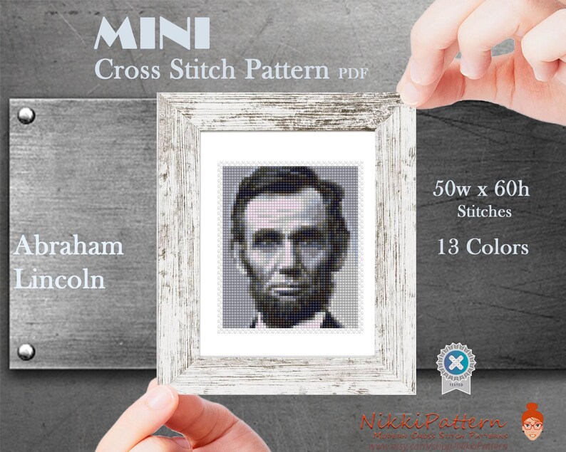 May include: A cross stitch pattern of Abraham Lincoln's portrait in black and white. The pattern is 50 stitches wide by 60 stitches high and uses 13 colours.