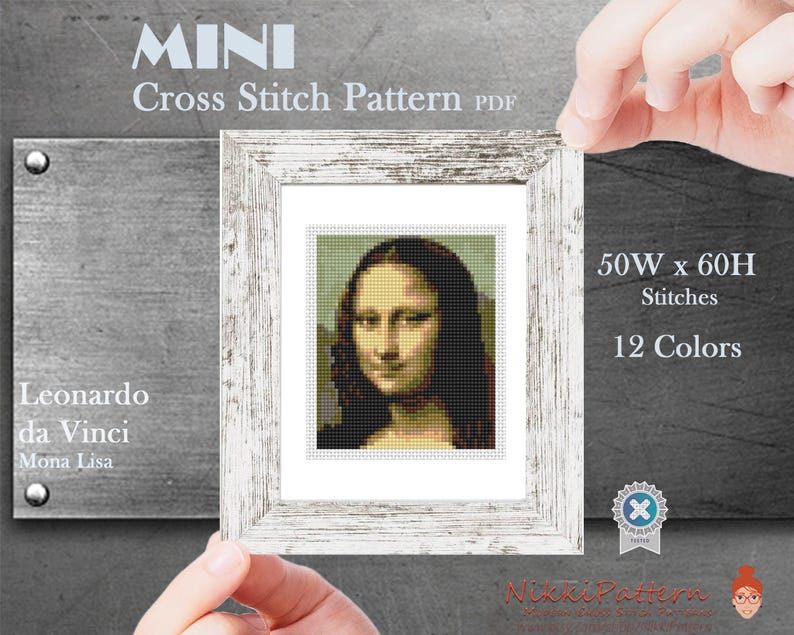May include: A framed cross-stitch pattern of the Mona Lisa by Leonardo da Vinci. The pattern is labeled "MINI" and includes details: 50W x 60H stitches, 12 colors. The frame is white with a distressed finish.