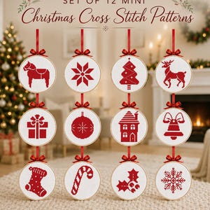 May include: A set of 12 mini Christmas cross stitch patterns displayed in circular wooden hoops. Each white fabric hoop features a red stitched holiday icon, including a horse, star, tree, deer, gift, ornament, house, bell, stocking, candy cane, holly, and snowflake.