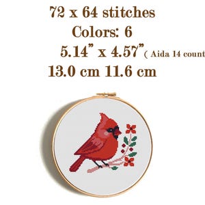 May include: A cross-stitch embroidery hoop featuring a red cardinal bird perched on a branch with red flowers and green leaves. The design is 5.14" x 4.57" and uses 6 colors. The text reads "72 x 64 stitches" and "Colors: 6".