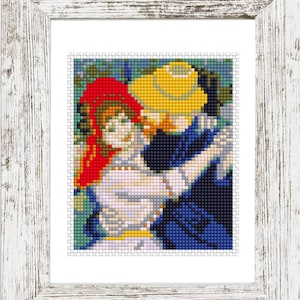 May include: A framed cross-stitch artwork depicting two figures dancing. The figures are wearing hats, one red and one yellow, and are dressed in white, blue, and yellow. The frame is white with a distressed finish.