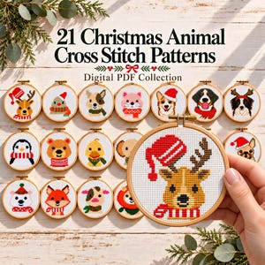 May include: A collection of 21 Christmas animal cross stitch patterns presented as a digital PDF. The image displays various circular embroidery hoops containing stitched designs of animals like reindeer, dogs, and penguins wearing festive winter accessories.