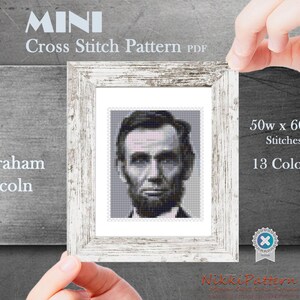 May include: A cross stitch pattern of Abraham Lincoln, a black and white portrait of the 16th president of the United States. The pattern is 50 stitches wide by 60 stitches high and uses 13 colours.