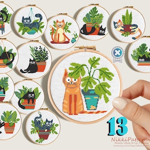 May include: A set of 13 cross stitch patterns featuring cats and plants in pots. The patterns are in a variety of colors, including black, white, orange, green, and brown. The patterns are perfect for beginner cross stitchers.