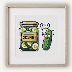 May include: A cartoon illustration of a jar of pickles with the label "CUCUMBER" and a scared-looking cucumber with a speech bubble saying "!!!".