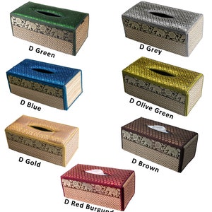 May include: Set of ten tissue box covers in various colors, including green, grey, olive green, blue, gold, brown, and red burgundy. Each cover features a woven pattern with an intricate design of elephants and flowers.