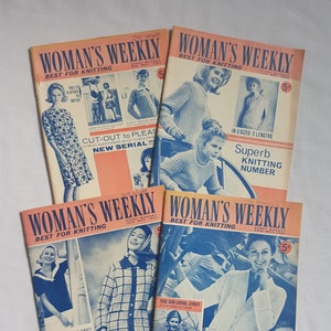 May include: A stack of vintage "Woman's Weekly" magazines with orange and blue covers. The covers feature images of women and children modeling knitted clothing. Text includes "Best for Knitting" and various knitting patterns.