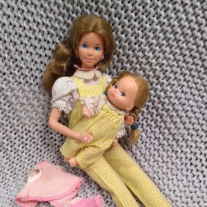 Vintage Heart Family Barbie Mom with baby girl in matching yellow jumpsuits - includes extra baby outfits c. 1984 Mattel