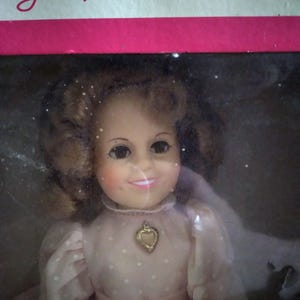 NRFB Vintage Ideal 12-inch Shirley Temple doll in pale pink dress with gold heart locket, &quot;The Little Colonel&quot; c. 1982