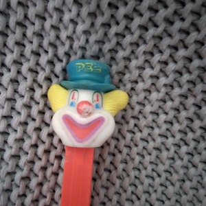 Peter the Clown Pez Dispenser on a red body