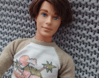 Beach Fun Ken doll - the New Look with rooted brunette hair wearing a beach tee with dark denim and black sneakers