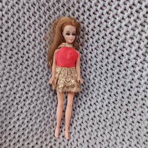 Beautiful Dancing Dawn doll in her Original Neon Orange and Gold Lame Zig Zag Dress c. 1970 Topper co.