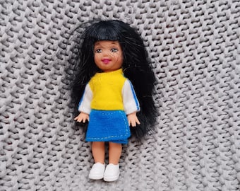 Kelly Club friend Jenny in a long sleeved yellow and navy-blue dress c. 1994 Mattel
