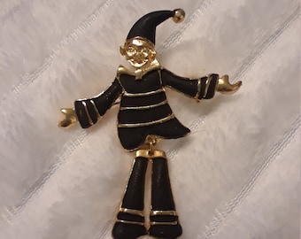 Vintage gold tone and black enamel articulated harlequin brooch