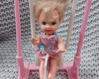 Eatin' Fun Kelly - littlest sister of Barbie in a playground horse swing c. 1997 Mattel