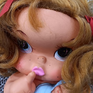 Vintage 1970&#39;s 10&quot; Japanese Sekiguchi big eyes redheaded girl shushing doll cradling a baby