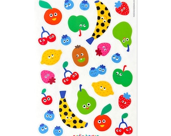 May include: A sheet of colorful fruit and berry stickers with happy faces. The stickers include a banana, kiwi, pear, lemon, apple, cherries, strawberries, and blueberries. The stickers are perfect for adding a touch of whimsy to any project.