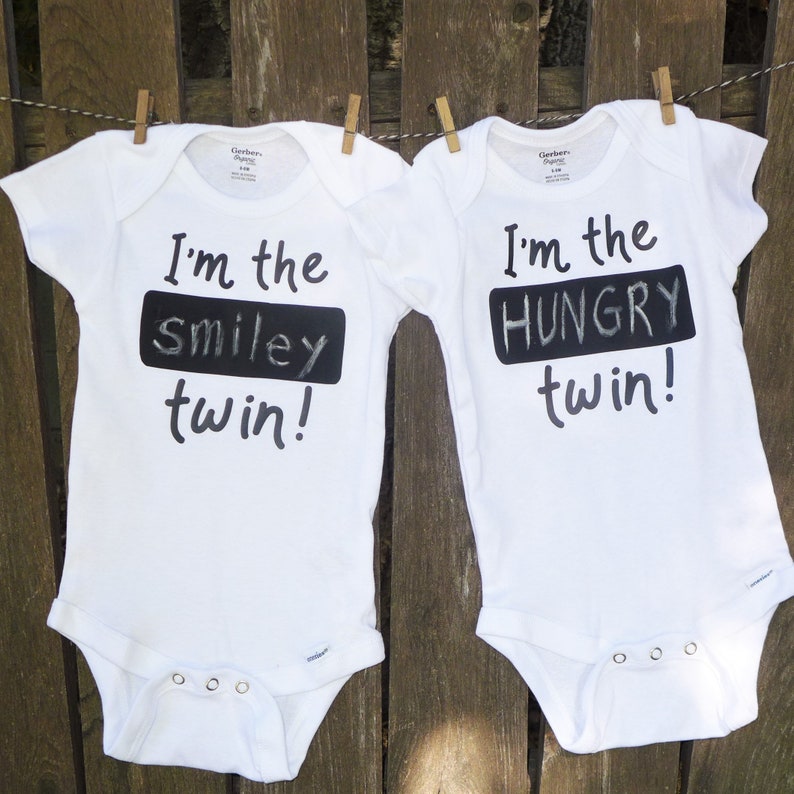 2 twin Onesies\u00ae with erasable chalkboard to identify your special twins Fun with twins! Personalize twin Onesie\u00aes with blackboard on shirt
