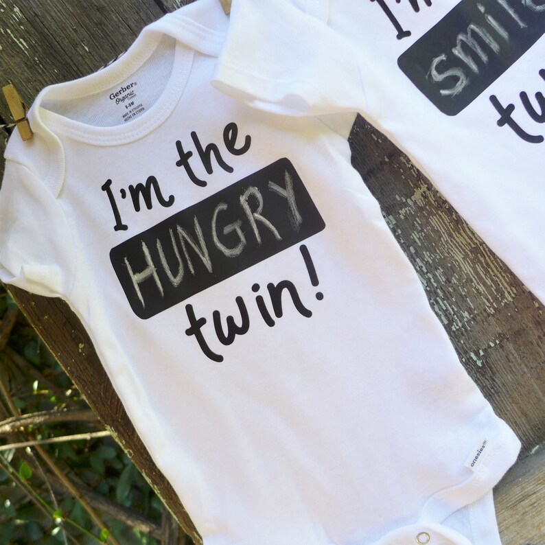 2 twin Onesies\u00ae with erasable chalkboard to identify your special twins Fun with twins! Personalize twin Onesie\u00aes with blackboard on shirt