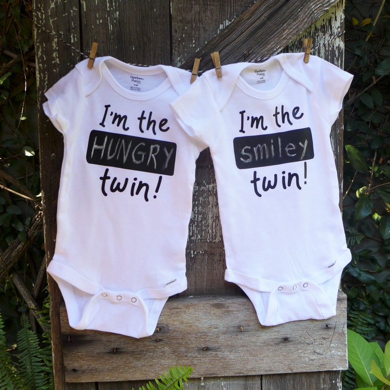 2 twin Onesies\u00ae with erasable chalkboard to identify your special twins Fun with twins! Personalize twin Onesie\u00aes with blackboard on shirt