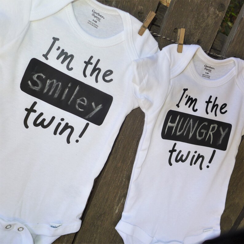 2 twin Onesies\u00ae with erasable chalkboard to identify your special twins Fun with twins! Personalize twin Onesie\u00aes with blackboard on shirt