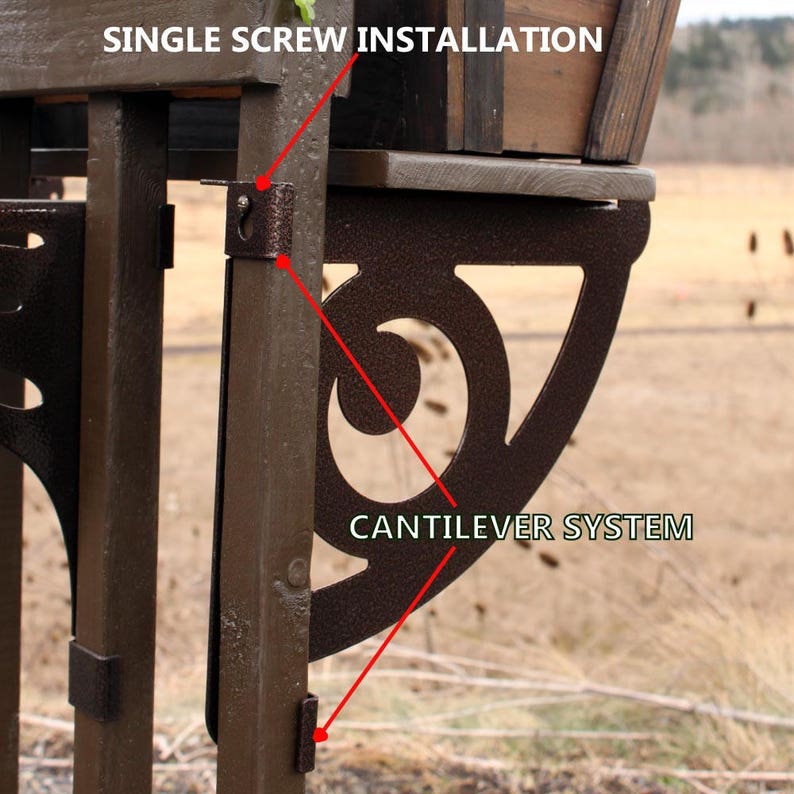 May include: A close-up of a brown wooden planter with a metal cantilever system. The planter is attached to a wooden post with a single screw. The text "SINGLE SCREW INSTALLATION" and "CANTILEVER SYSTEM" are visible in the image.