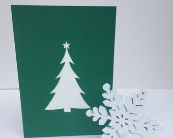 Shimmering Silver Christmas Tree with Star Papercut on Festive Green Card.