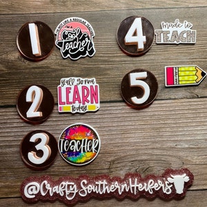 May include: Set of five brown and white round resin coasters with numbers 1 through 5.  Each coaster has a different teacher-themed design with text such as "I'm a cool teacher", "Y'all gonna learn today", and "Made to teach".  A pink and white glitter banner with the text "@Crafty Southern Herfers" and a white cow silhouette.