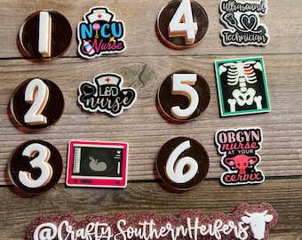 May include: A set of six round, black and white numbered circles with a gold trim. Each circle has a white number from 1 to 6. The circles are surrounded by various colorful stickers with text related to healthcare professions, including "NICU Nurse", "L&D Nurse", "Ultrasound Technician", "OBGYN Nurse", and "@Crafty Southern Herfers".