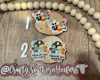May include: Two sets of Halloween-themed character ornaments. One set features Stitch and Angel from Lilo & Stitch dressed as Jack Skellington and Sally from The Nightmare Before Christmas. The other set features Stitch and Angel dressed as a witch and a mummy. Both sets have the text "Trick or Treat" on them.