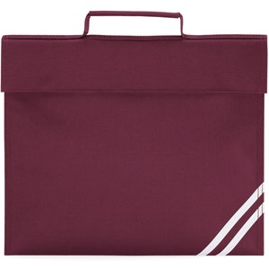 Puede incluir: Una mochila escolar de color burdeos con un asa blanca y dos rayas blancas en el lateral.