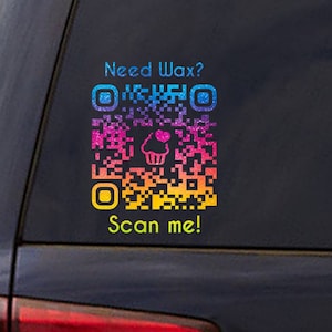 May include: A colorful QR code sticker on a black car with the text "Need Wax? Scan me!" The QR code has a pink cupcake with a heart on top in the center.