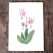 The 5x7 vertical pink flower art print rests on a dark wood background.