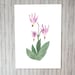 The 5x7 vertical pink flower art print rests on a light wood background.