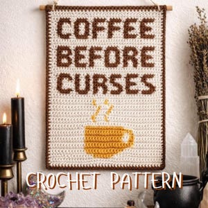 May include: Cream-coloured crocheted wall hanging with brown text reading "COFFEE BEFORE CURSES". A yellow coffee cup graphic is below the text. The words "CROCHET PATTERN" are at the bottom.