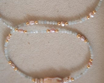 Aquamarine, keshi pearl, and puka shell necklace