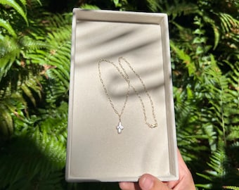 pearl cross necklace on dainty paperclip chain